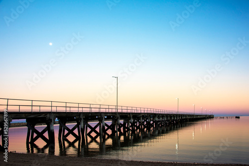 Wallpaper Mural Jetty leading off into ocean at sunrise Torontodigital.ca