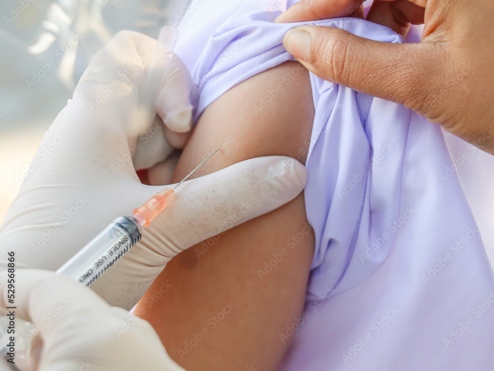 children's coronavirus vaccine sit vaccinated with syringe against covid-19. children's coronavirus vaccine sit vaccinated with syringe against covid-19.