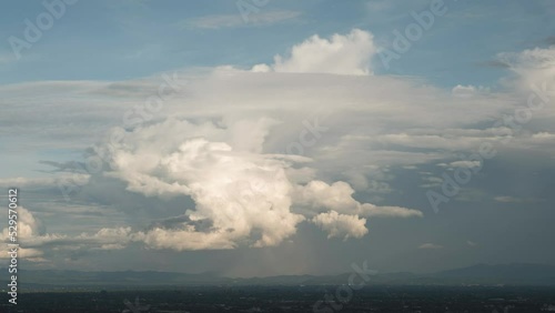 time lapse clouds over country side.