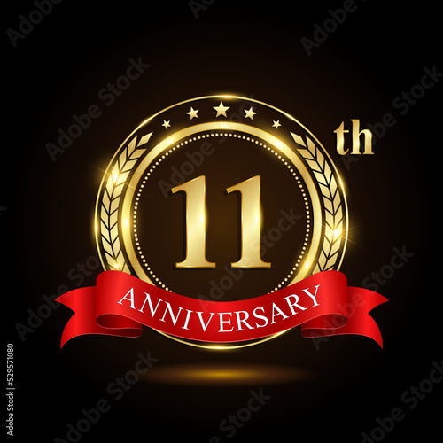 11th golden anniversary logo, with shiny ring and red ribbon, Laurel wrath isolated on black background, vector design