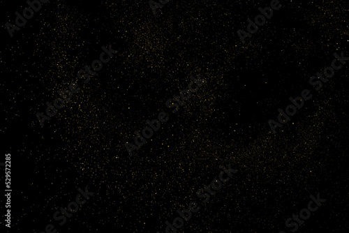 Fototapeta Naklejka Na Ścianę i Meble -  Gold Glitter Texture Isolated on Black Background. Golden stardust. Amber Particles Color. Sparkles Rain. Vector Illustration, Eps 10.