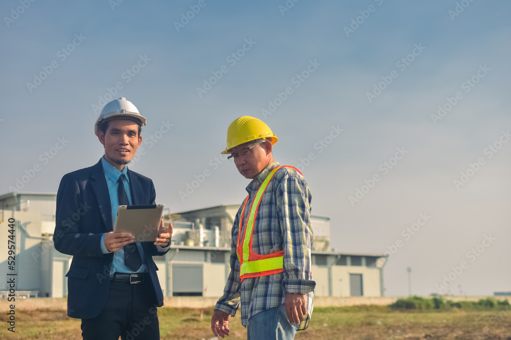 Asian engineer construction team checking work for control and management in the construction site or building site Asian engineer construction team checking work for control and management in the construction site or building site