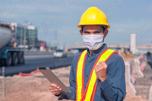 Asian Engineer construction are worker employee working by safety control helmet on site building