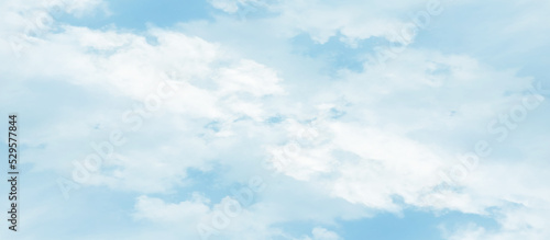 Abstract fantastic and realistic blue sky background, blurry and puffy cloudscape morning sky of the winter season, blue watercolor shades clouds of blue natural sky with clouds.