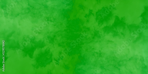 Abstract grainy green paint background, old-style green grunge texture,  scratched and grainy green paper texture, Green grainy chalkboard or cardboard texture, green background with scratches.