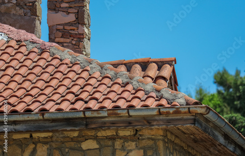 Old tiles on the roof of the house © schankz