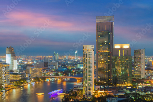 Bangkok city skyline. Landscape of building at Bangkok central business around the Chao Phraya river. Aerial view of Thailand modern building in business district area. © molpix