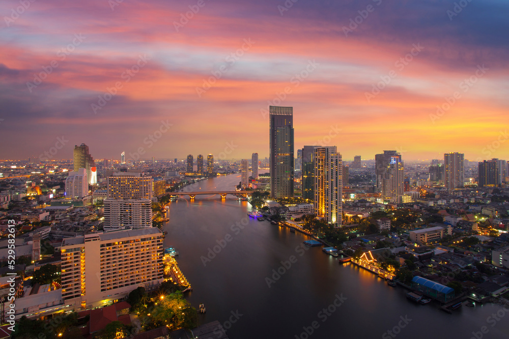 Fototapeta premium Bangkok Cityscape at dusk. Landscape of Bangkok business building at economic zone. Thailand aerial modern building in business district area at twilight.