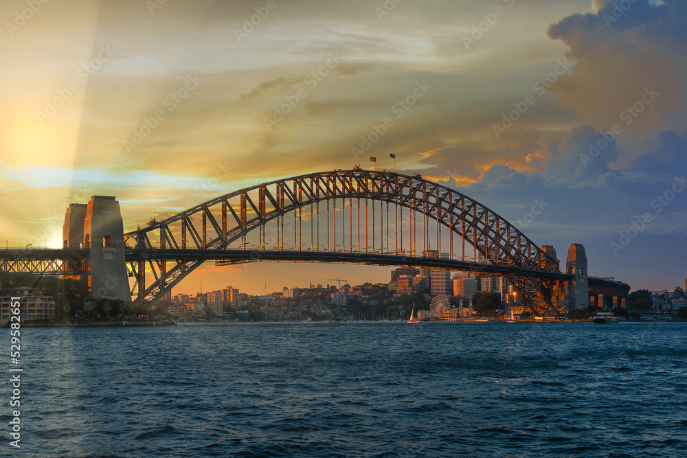 Sunset at Sydney Harbour Bridge located at Australia Landscape of building at Sydney central business around the harbour. Aerial view of Sydney business building at dusk. Sunset at Sydney Harbour Bridge located at Australia Landscape of building at Sydney central business around the harbour. Aerial view of Sydney business building at dusk.