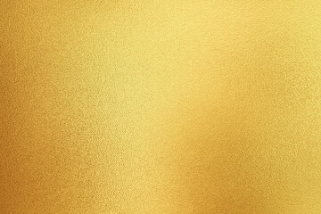 Gold wall texture background. Yellow shiny gold foil paint on wall surface with light reflection, vibrant golden luxury wallpaper