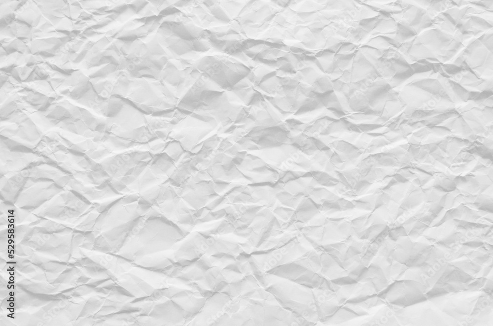 Fototapeta premium Creative background with scattered overlay of crumpled white paper.