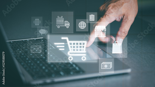 Ecommerce concept and online selling website Cyberspace-based retail businesses use it to communicate between store owners and customers, virtual shopping carts on a laptop.