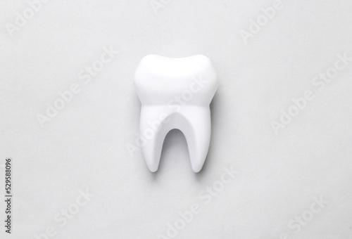 Fototapeta Naklejka Na Ścianę i Meble -  Healthy teeth concept. Tooth model on gray background