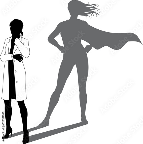 A superhero female scientist, engineer, doctor or teacher in a lab white coat woman. Revealed by her shadow silhouette as a super hero in a cape.