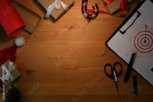 Laptop, supplies and Christmas decoration on wooden table. Top view with copy space for, Business Holidays Concept