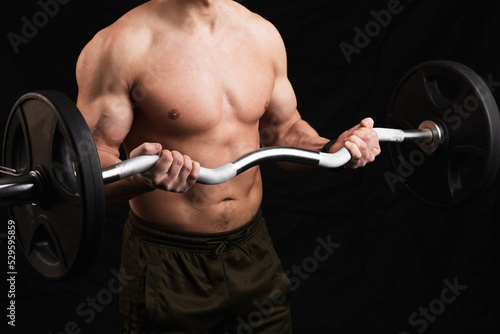 the male torso holds a curved barbell in his hands