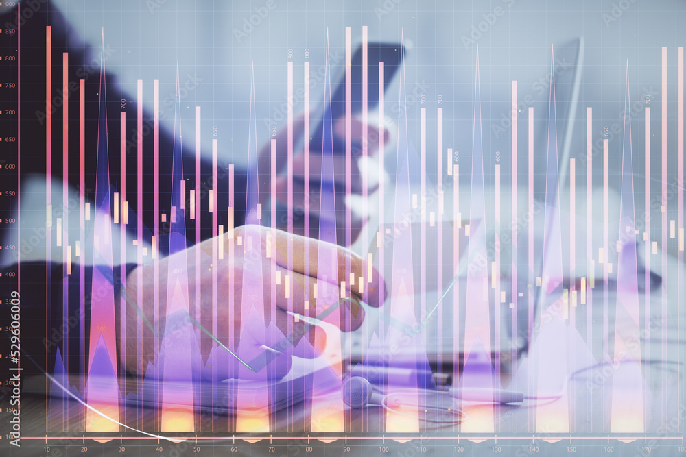 Double exposure of man's hands holding and using a phone and financial graph drawing. Analysis concept. Double exposure of man's hands holding and using a phone and financial graph drawing. Analysis concept.