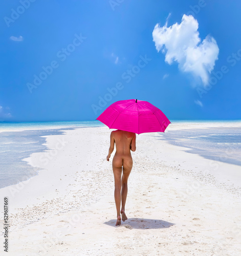 Sexy nude body woman on paradise tropical beach having fun on Maldives. Beautiful naked female model is holding pink umbrella and is walking on the sandy beach. Sexy buttocks girl on a paradise beach.