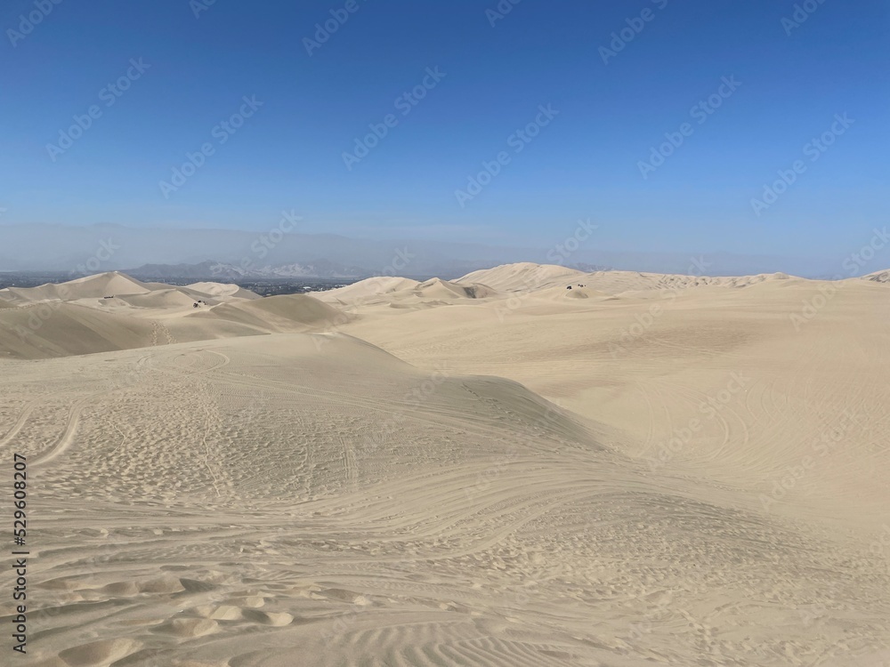 Panoramic view of the sand dunes of Huacachina desert in Peru Panoramic view of the sand dunes of Huacachina desert in Peru