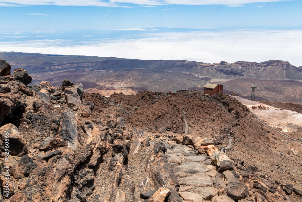 Altavista Mountain Refuge near summit of volcano Pico del Teide, Tenerife, Canary Islands, Spain, Europe. Panoramic view on barren landscape, solidified lava, ash, pumice. Lift station next to the hut