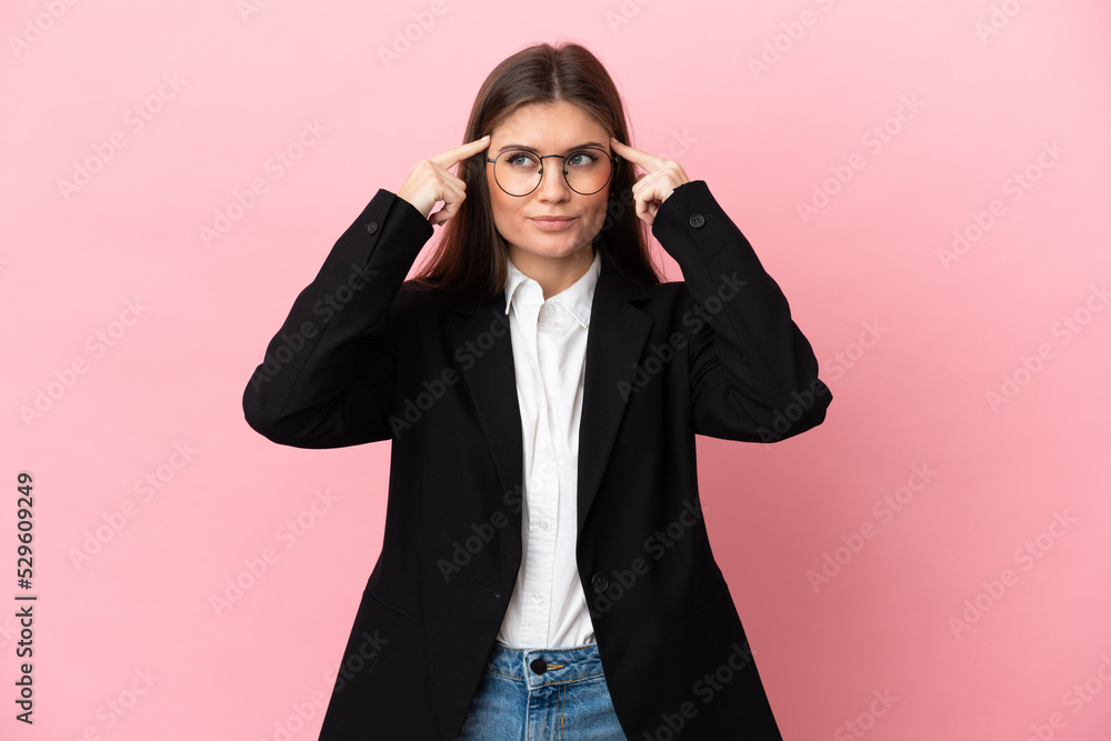 Young Business caucasian woman isolated on pink background having doubts and thinking Young Business caucasian woman isolated on pink background having doubts and thinking