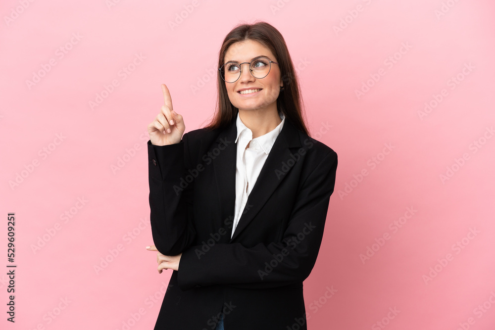 Young Business caucasian woman isolated on pink background pointing up a great idea Young Business caucasian woman isolated on pink background pointing up a great idea