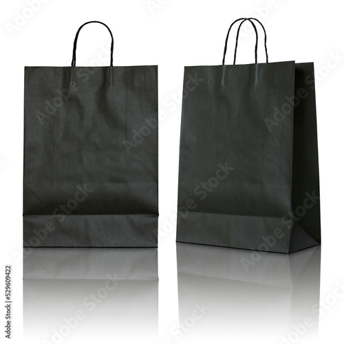 black paper bag isolated with reflect floor for mockup photo