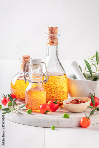 Tasty and healthy oil in bottle with dried tomatoes.