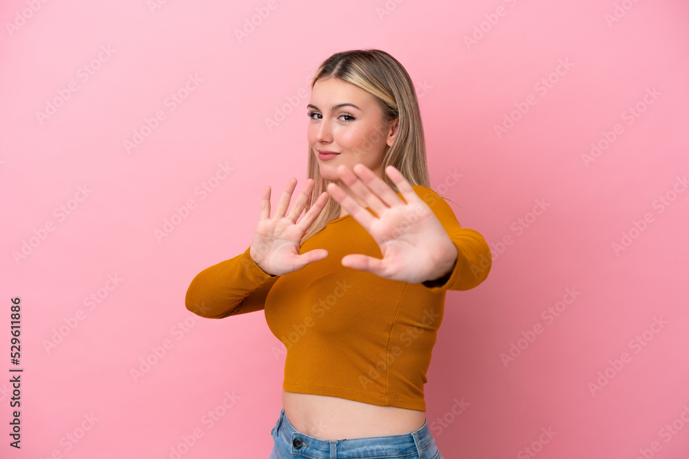 Young caucasian woman isolated on pink background nervous stretching hands to the front Young caucasian woman isolated on pink background nervous stretching hands to the front