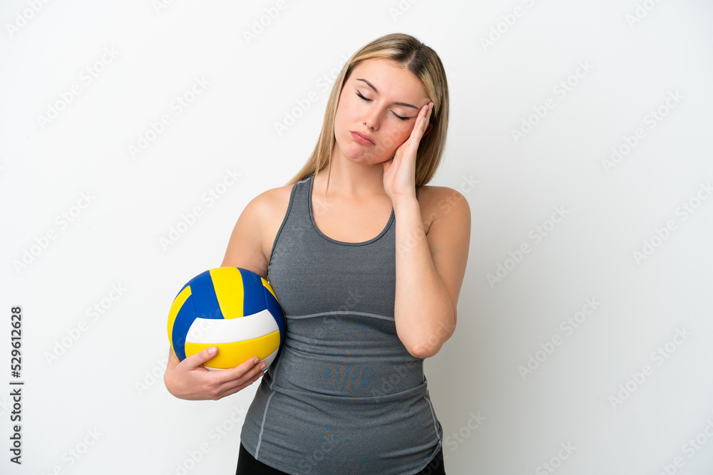 Young caucasian woman playing volleyball isolated on white background with headache Young caucasian woman playing volleyball isolated on white background with headache