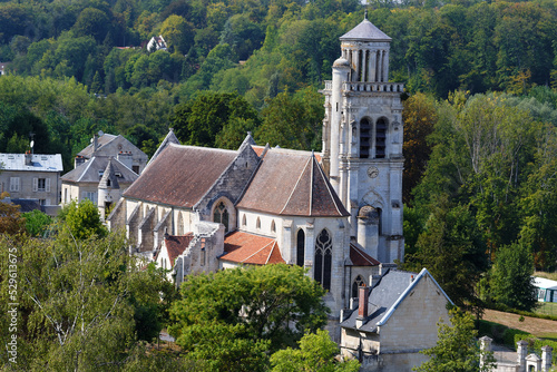 Slika na platnu Saint-Sulpice Church is a lovely Catholic parish church located in Pierrefonds surrounded by greenery