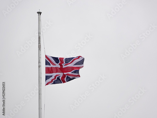 British United Kingdon English country flag at half-mast photo