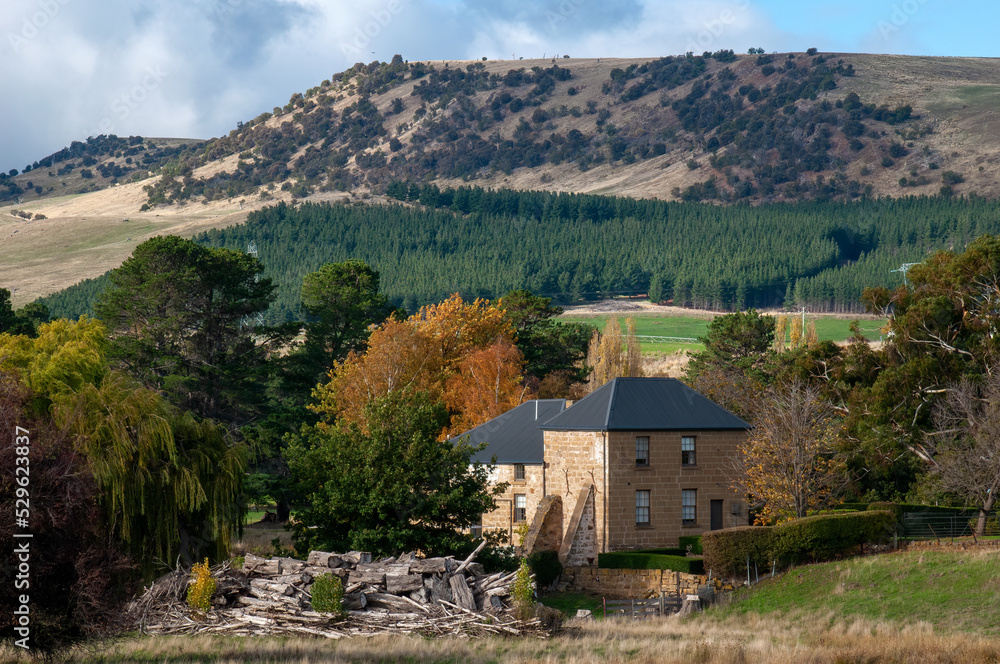 Ouse Australia, view across valley with stone farmhouse in foreground