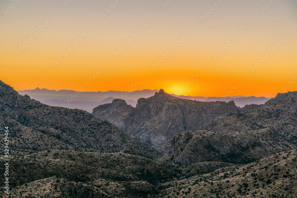 Scenic Santa Catalina mountain range with golden sky in the horizon at sunset
