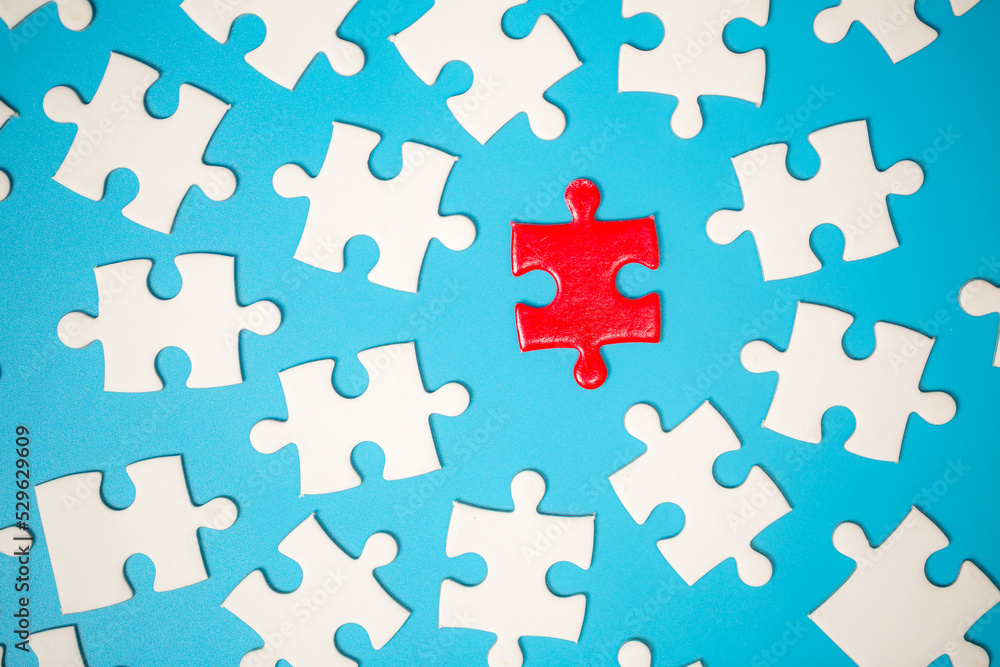 White part of jigsaw puzzle pieces on blue background. concepts of problem solving, business success, teamwork, Team playing jigsaw game incomplete, Texture photo with copy space for text