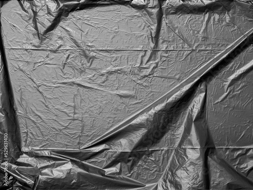 top shot of dark garbage bag foil plastic material, photo overlay layer.