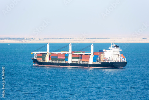 Fully loaded, cargo container ship entering Suez Canal.