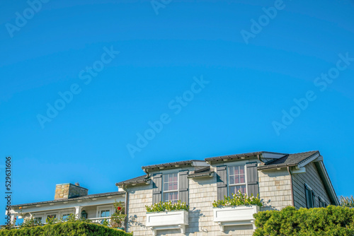 House exterior at Del Mar Southern California against bright and clear blue sky