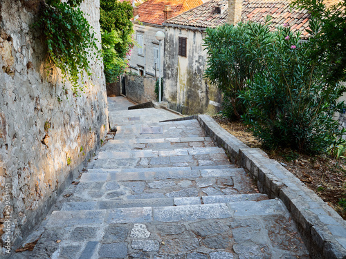 Stone steps in a charming narrow steep pedestrian street leading to Dubrovnik old town. Croatia  Europe