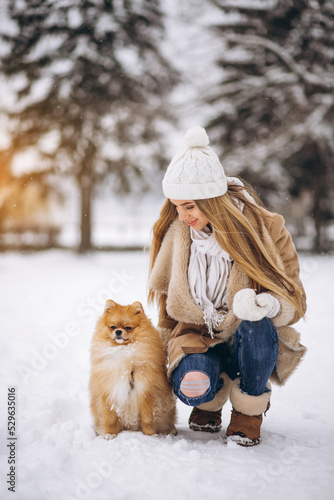 Woman with dog in winter