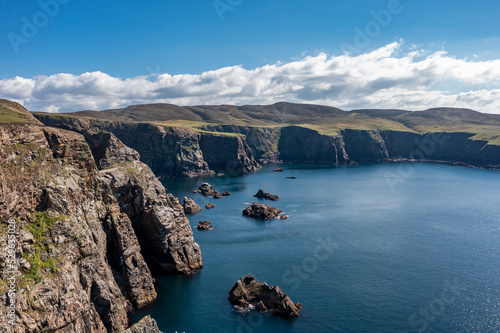 Aerial view of the cliffs near the lighthouse on the island of Arranmore in County Donegal, Ireland © Lukassek