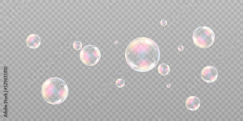 Realistic soap bubbles with iridescent reflection and highlights. On a transparent background.