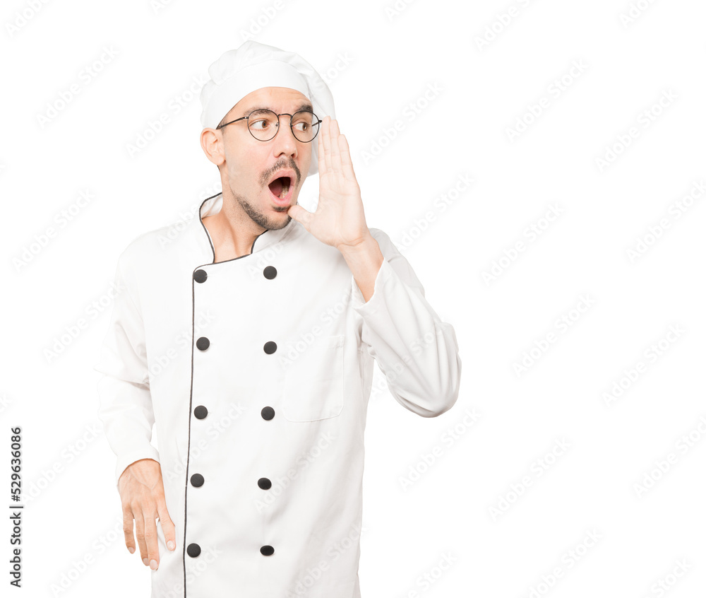 Angry young chef trying to say something strongly Angry young chef trying to say something strongly