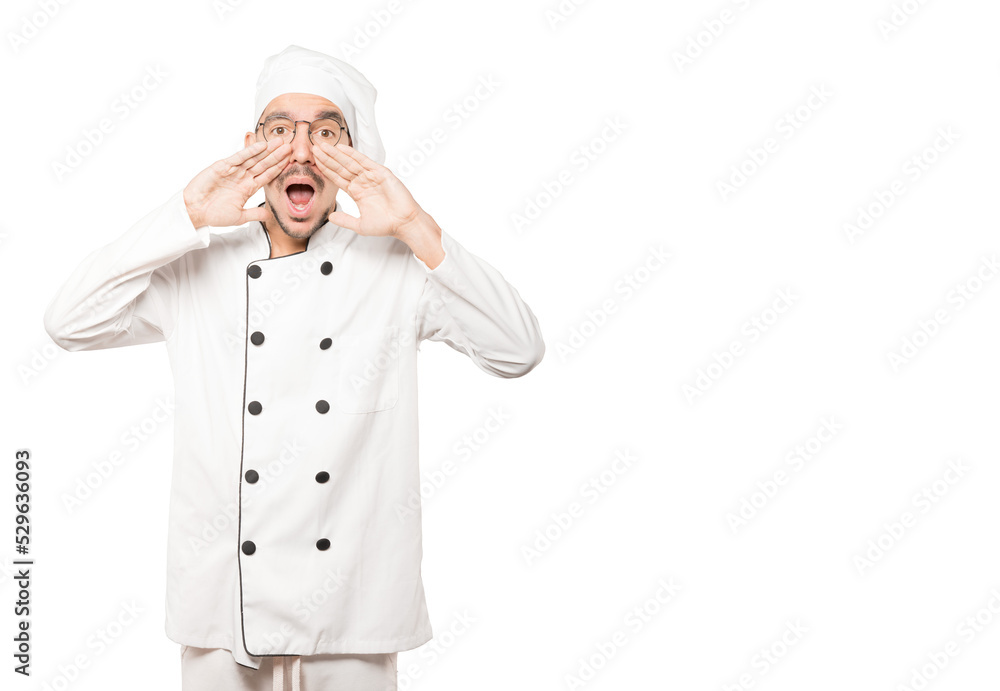 Angry young chef trying to say something strongly Angry young chef trying to say something strongly