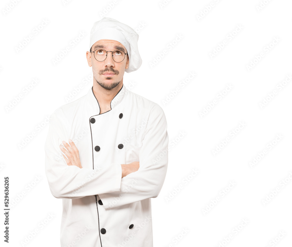 Amazed young chef looking gesture