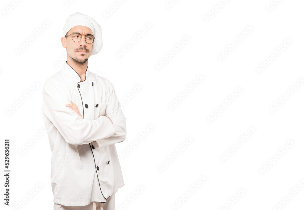 Hesitant young chef looking gesture Hesitant young chef looking gesture