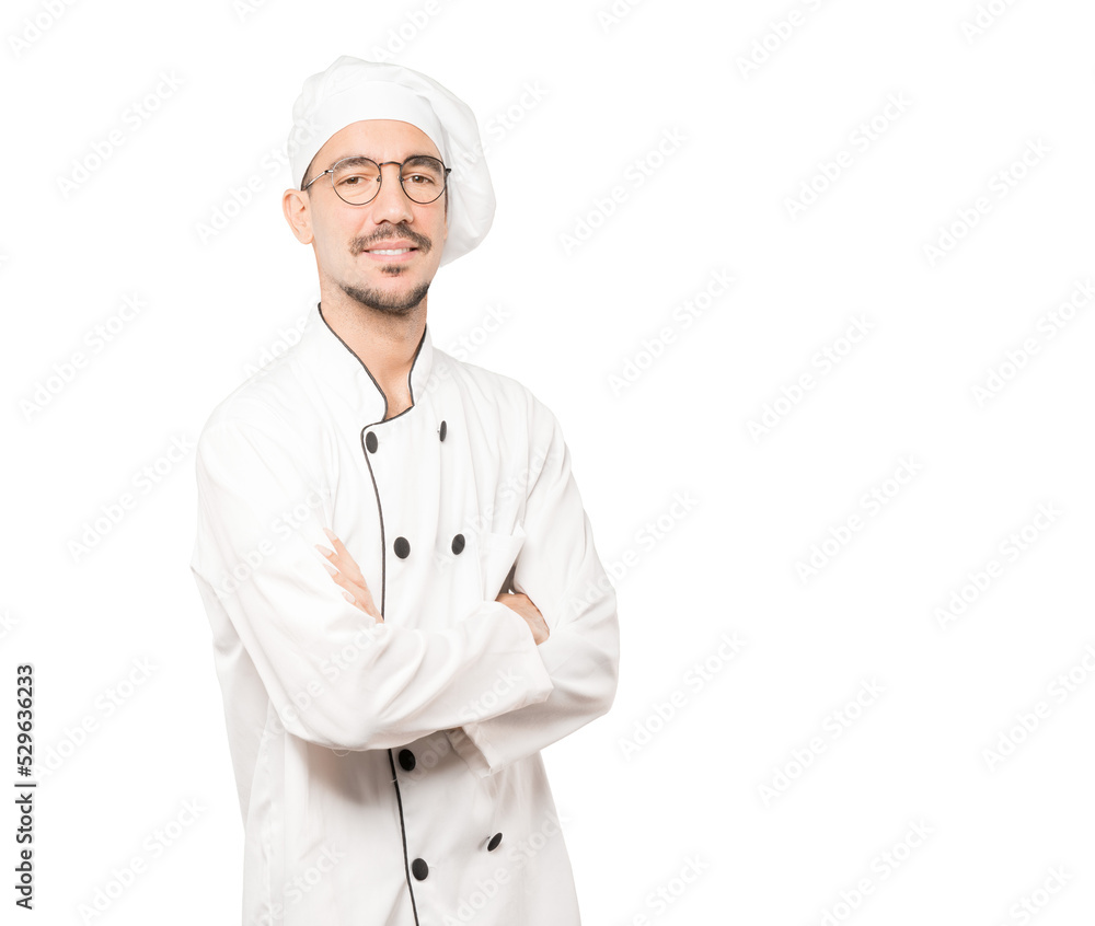 Serious young chef looking up gesture