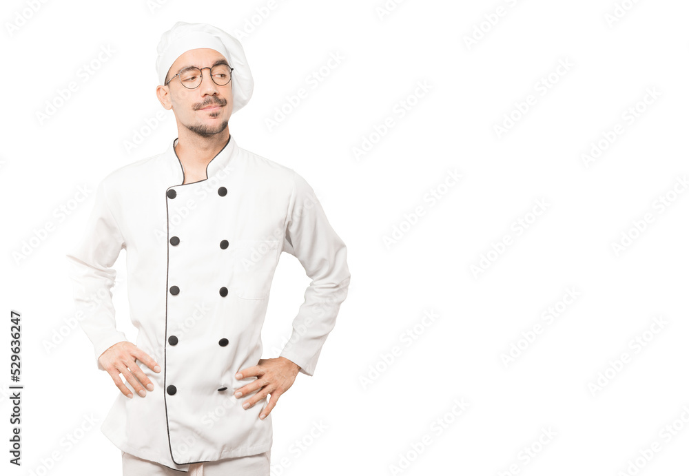 Hesitant young chef looking up gesture Hesitant young chef looking up gesture