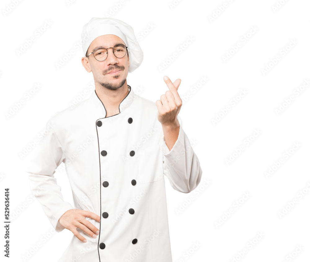 Young chef making a gesture of worried about his economy Young chef making a gesture of worried about his economy