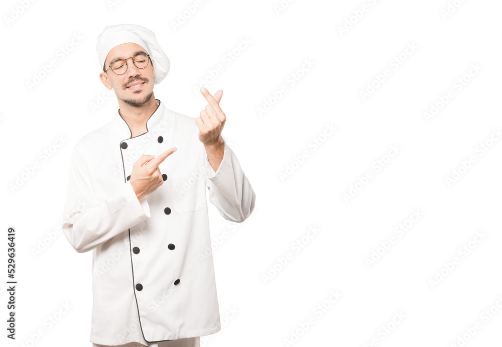 Young chef making a gesture of worried about his economy Young chef making a gesture of worried about his economy